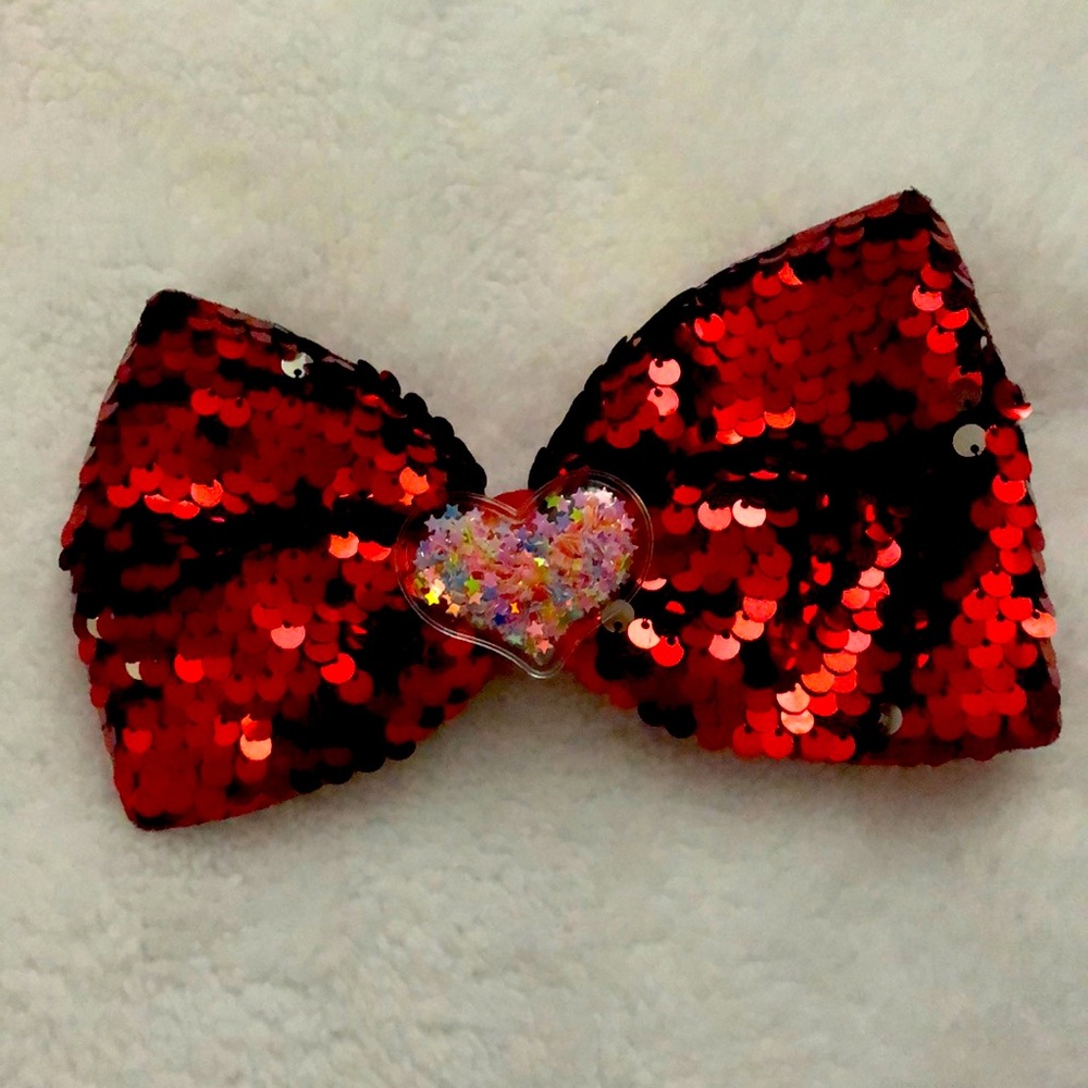 2 for $8 Large red sequined bow with heart in middle